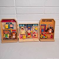 All three Dolly Pops boards side by side with dolls and outfits attached