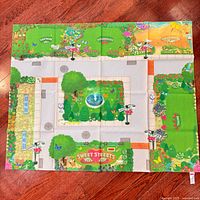 Full view of unfolded Fisher-Price Sweet Streets play mat on floor