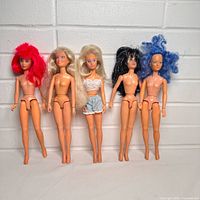 Front view of five dolls standing