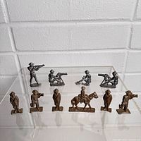 Group shot of all ten metal soldiers on two levels