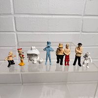 Group shot of eight plastic comic figures
