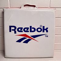 Front view showing Reebok logo and handle cutout