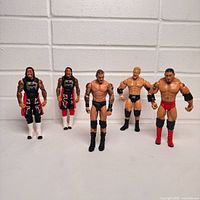 Group shot of all five WWE figures standing