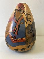 Front view showing elk and painted motifs on gourd vase
