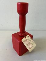 front view of red wooden hat stand