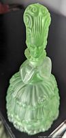 Front view of frosted green glass figural decanter showing full form
