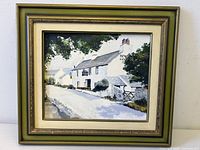 Full view of framed painting on white background