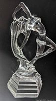 Front view of clear crystal nude dancing lady sculpture on stepped base