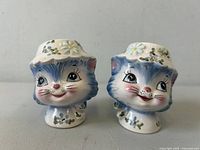 Front view of both Miss Priss cat salt and pepper shakers