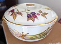 Side view showing asparagus motif and gold-rim handles