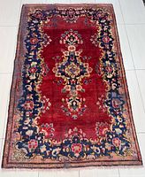 Full view of Kerman rug showing design, field and borders