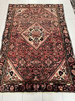 Full overhead view of entire rug showing field and borders