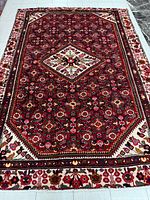 Full view of the Hamadan rug showing complete design and colors