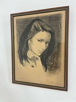 Full view of framed pencil portrait