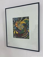 Frontal view of framed drawing showing artwork, mat and frame