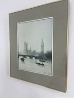 Angled view of framed print showing matting and frame
