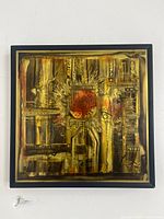 Frontal view of Bernhard Rohne signed acid-etched metal artwork in black frame