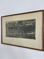 Framed linocut print on wall, full view