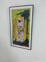 Full view of framed screen print on wall