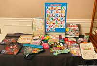 Overall view of all educational toys, games, crafts on table