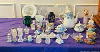 Wide view of entire lot showing glassware, teapot set, shakers and figurines