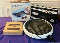 Overall lot showing four boxed/kitchen appliances