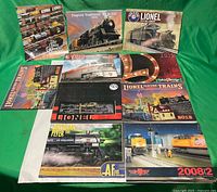 All ten catalogs spread on green background