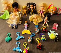 Group shot of dolls, keychains, charms and accessories