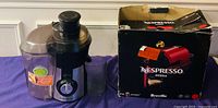 Hamilton Beach juicer alongside Nespresso Inissia box