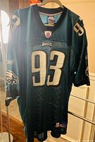 Front of Reebok Philadelphia Eagles #93 jersey displayed on hanger