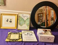 Group shot of mirror, four art pieces, and Sylvania light kit