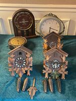 All six clocks and accessories displayed