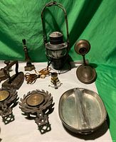 Group shot showing lantern, heater, warming pan, laurel plaques and more
