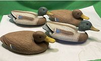 Four Flambeau plastic mallard duck decoys side view