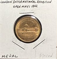 Obverse showing Exhibition Building design, entire medal in 2x2 holder