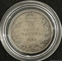 Reverse side of 1903 Canadian silver 25-cent coin in holder