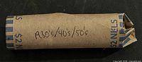 Side view of paper-wrapped roll marked $2 NICKELS and dated decades note
