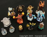 All 13 gaming figures and accessories grouped on dark background