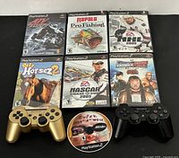 Full lot view showing six cased games, loose disc and two controllers