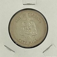 Obverse of medal with City of Toronto coat of arms and wording