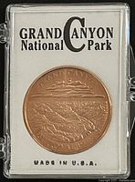 Medal in plastic holder on display card reading Grand Canyon National Park, Made in U.S.A.