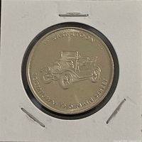 Obverse of nickel medal showing antique Willys style car and SASKATOON legend