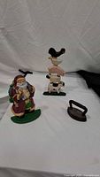 Overall lot showing Santa figurine, animal stack figurine and flat iron