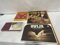 Group shot of four sealed board games