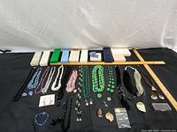 Overall lot showing all jewelry pieces with ruler reference and gift boxes