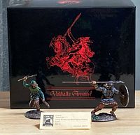 Two painted Viking miniatures in front of Valhalla Awaits box