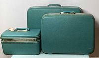 Three-piece Samsonite turquoise luggage set showing all items