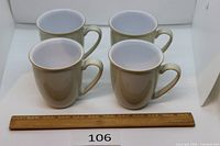 Four Denby Linen mugs front view with ruler for scale