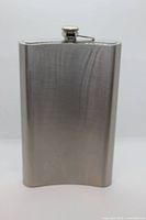 Front view of large stainless steel hip flask