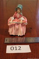 Front view of Royal Doulton Bo Peep figurine with ruler for scale